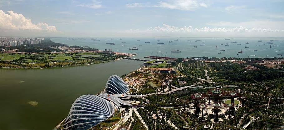 city building and body of water aerial photography during day time HD wallpaper