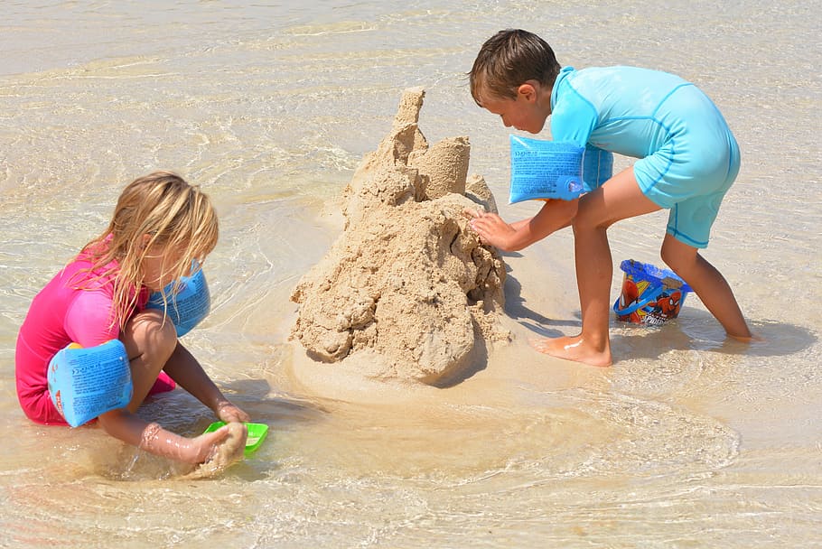 boy and girl build sand castle, children, people, beach, summer