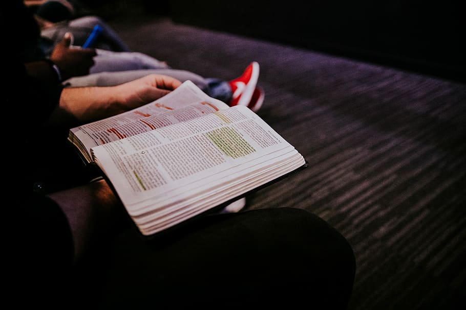 person reading book, person holding open book, text, dark, christ HD wallpaper