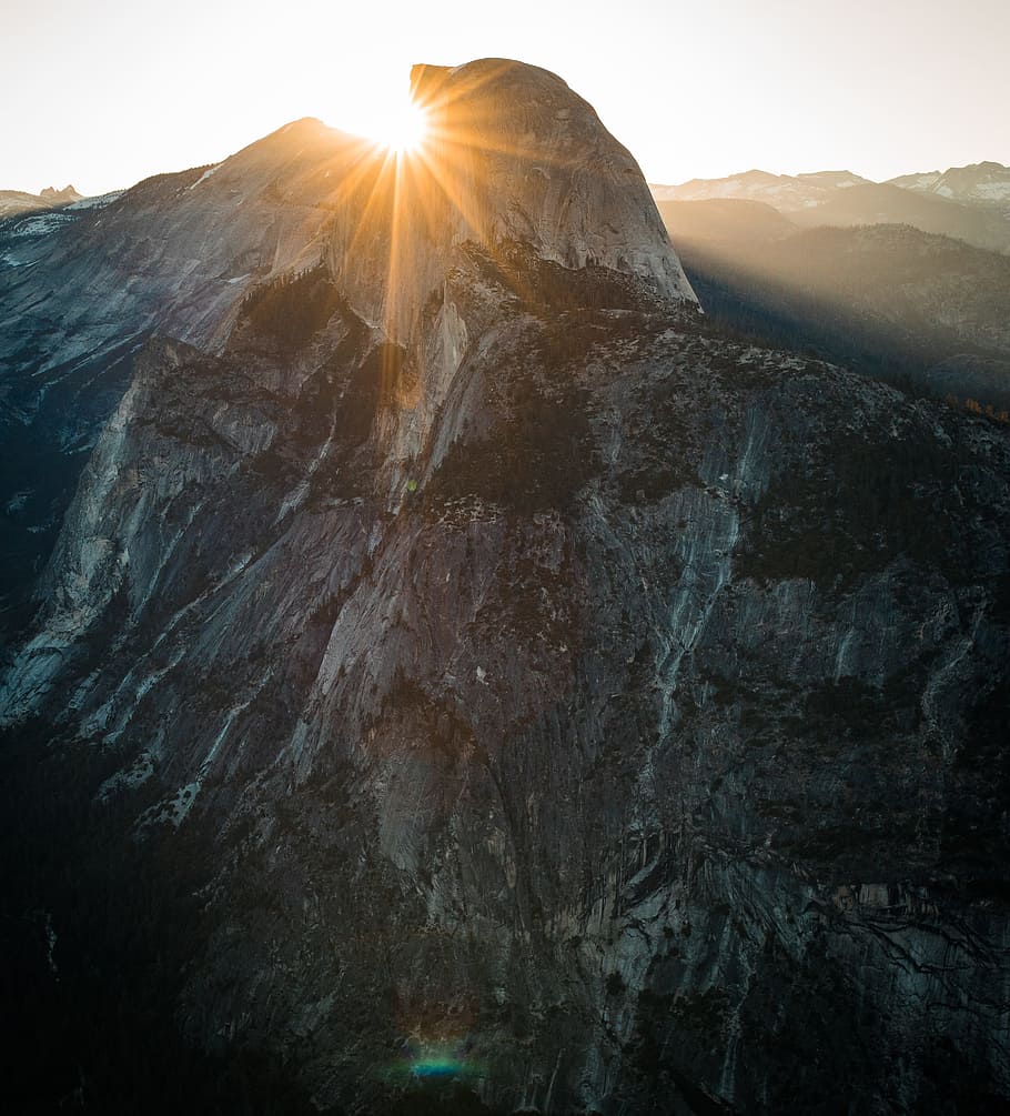 aerial photography of rocky mountain, rock mountain during gold hour HD wallpaper