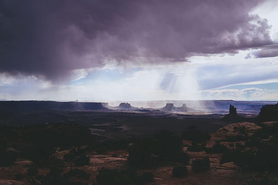 long exposure photography of grey cloud, gray clouds with rays of sun on Monument Valley HD wallpaper