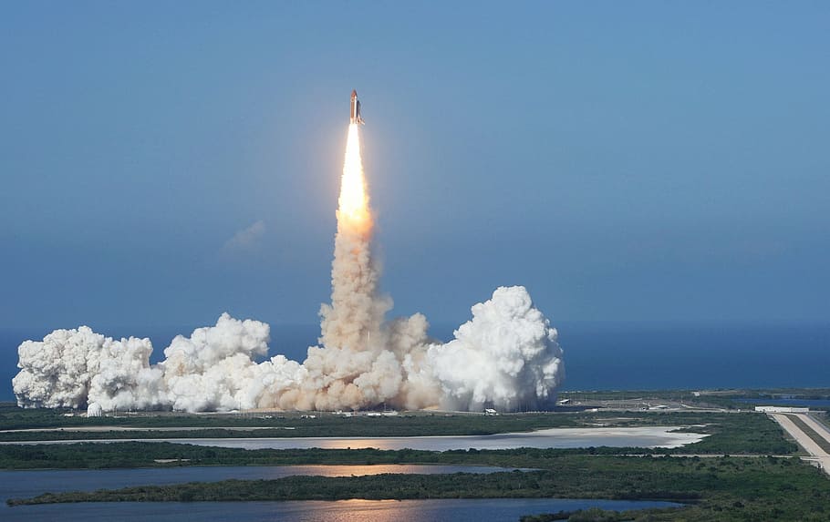 time lapse photography of rocket launch, discovery space shuttle