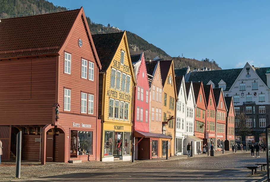 assorted-color wooden houses under bright sky, bergen, norway