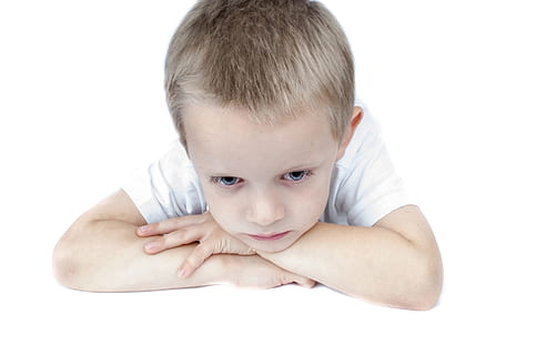 boy wearing white shirt arms and head on table, staring, sad HD wallpaper