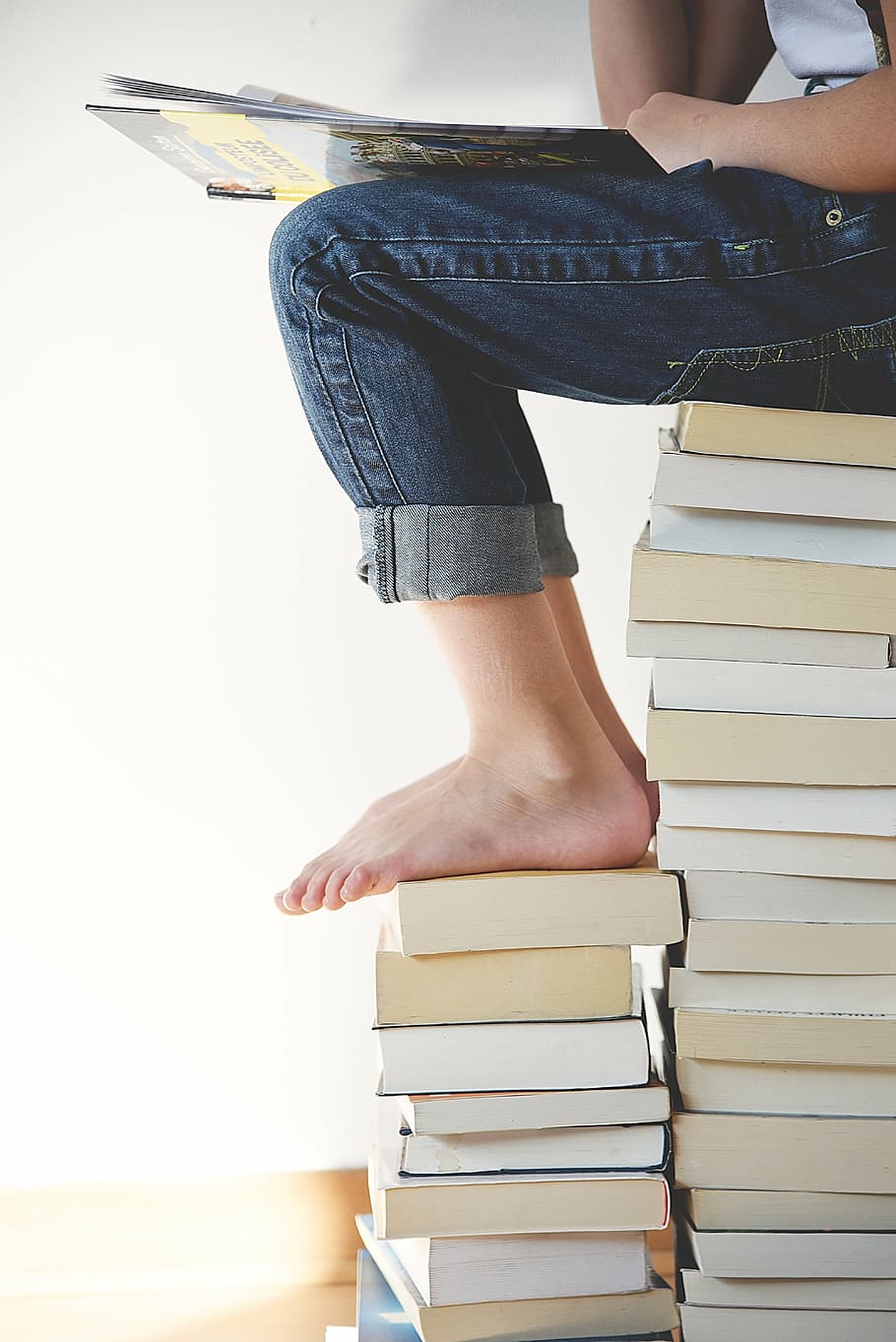 photo of person sitting on books, human, still, items, things HD wallpaper