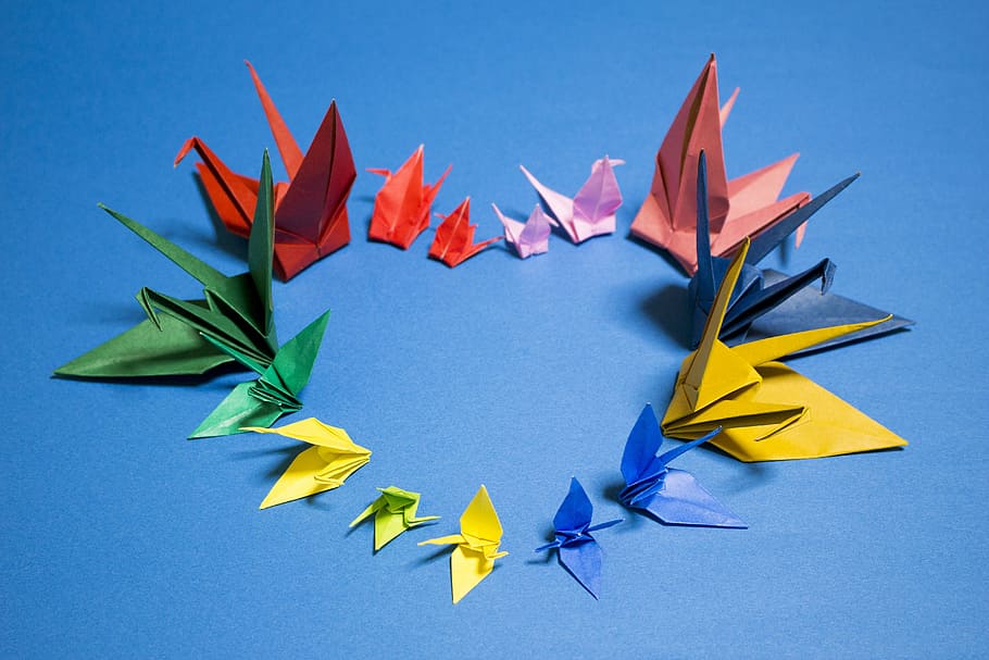 assorted-color bird origami on blue surface, crane, japan, heart