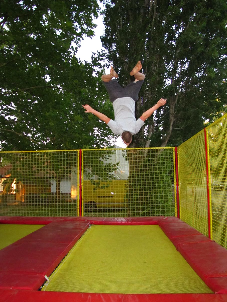 man jumping on green and red trampoline, sports, bounce man, go to