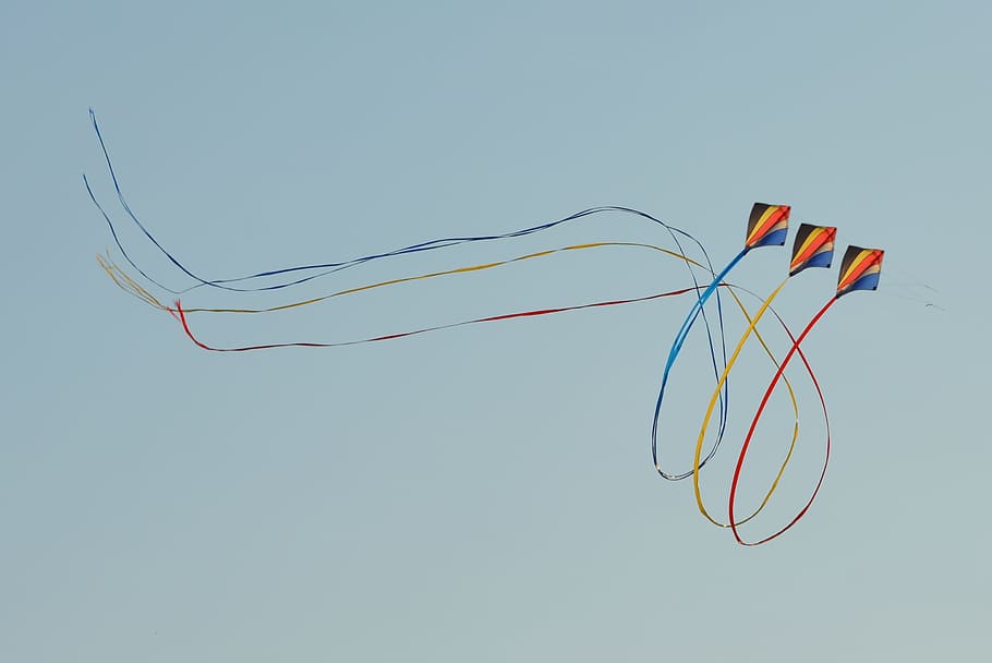 three black-yellow-and-orange kites, bottom, view, flying kites HD wallpaper