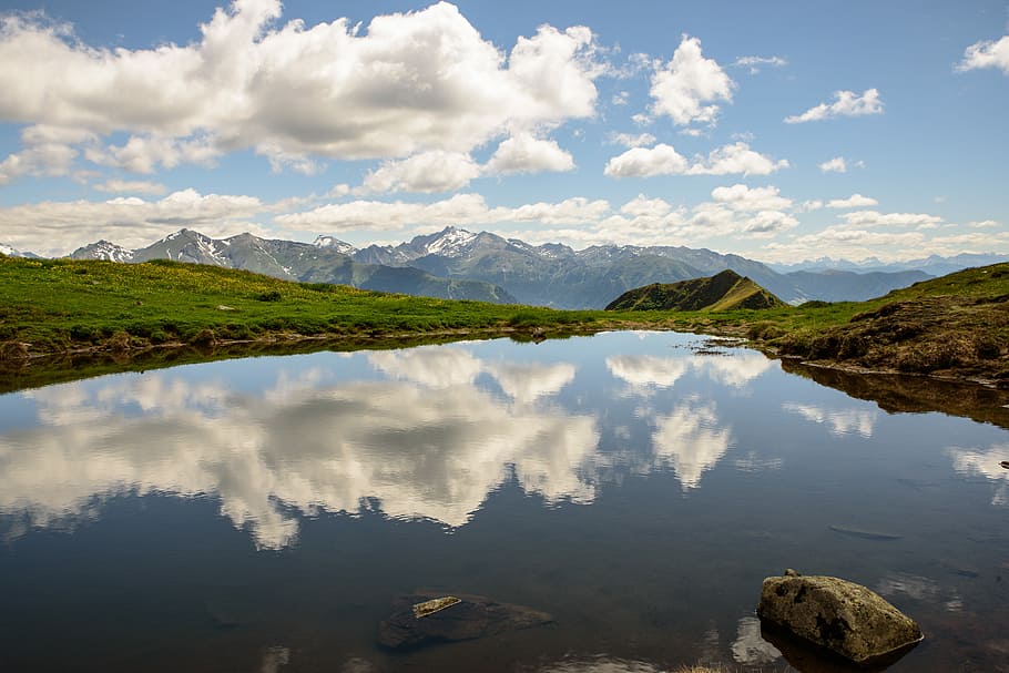 calm body of water in between of grass field, body of water between farm HD wallpaper