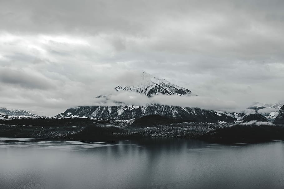 snow covered mountain, mountain near calm water grayscale photography HD wallpaper