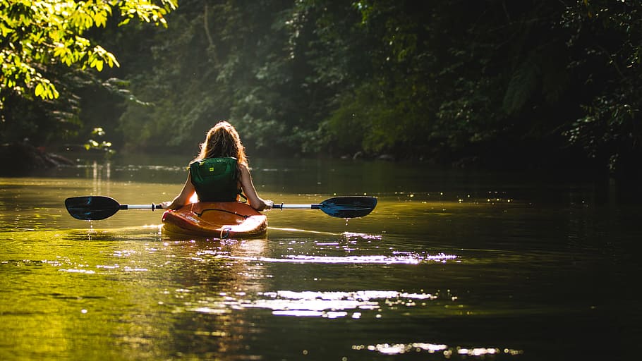 woman on kayak on body of water holding paddle, woman riding sit-in kayak on river, HD wallpaper