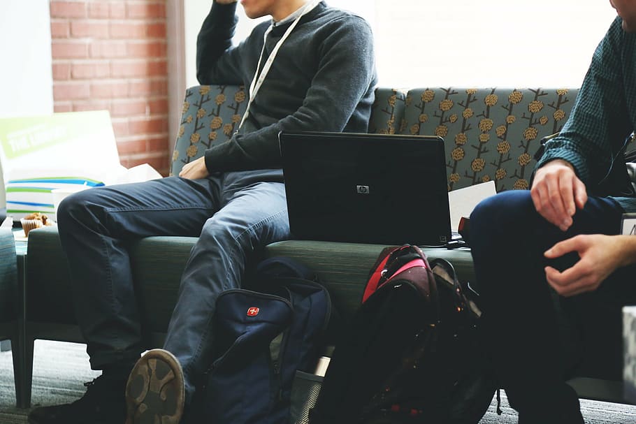 men wearing black sweater beside laptop during daytime, students HD wallpaper