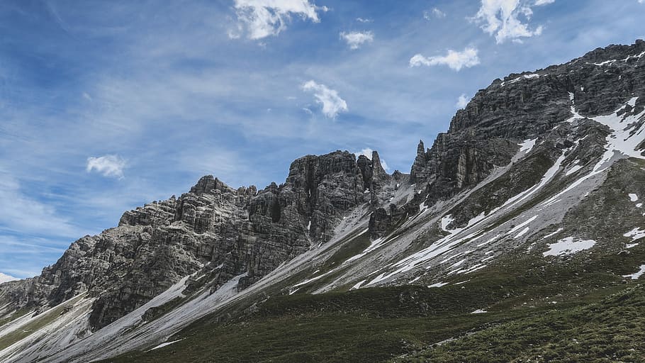 snow-covered mountain during daytime, landscape photography of rocky mountain under cloudy sky during daytime HD wallpaper