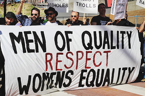 men holding white, black, and red Men of quality respect womens equality banner on road, group of men holding signage of men of quality respect womens equality HD wallpaper