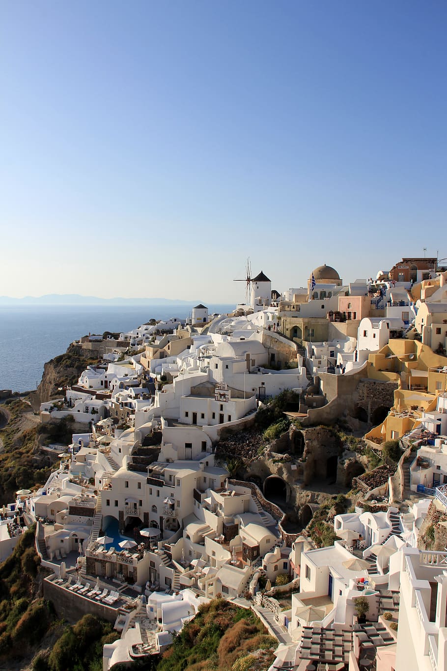 Santorini Island, Greece, white buildings on rock formation with sea in distant