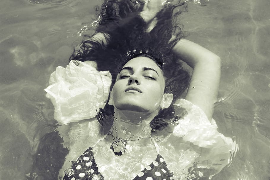 woman in swimwear floating on pool, woman floating on water, girl