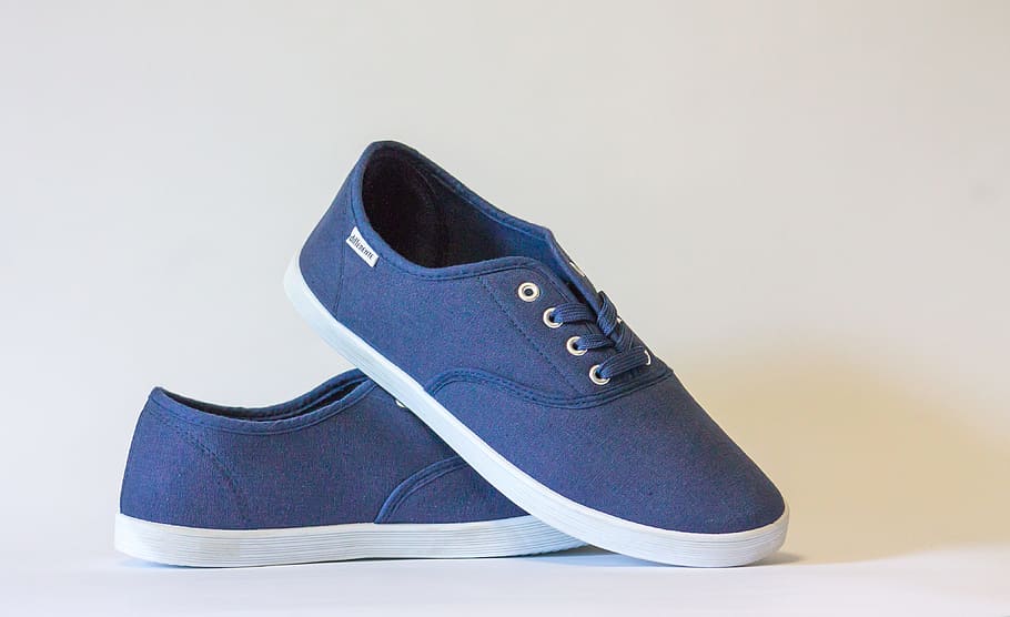 blue suede low top sneakers on the white surface, hipster, ecommerce
