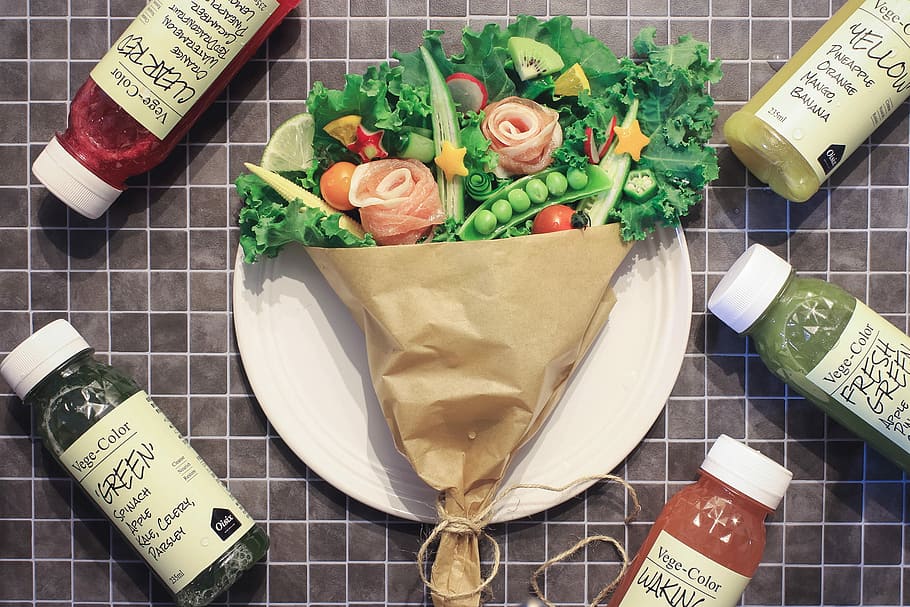 green vegetable in brown paper on round white ceramic plate, bottle HD wallpaper