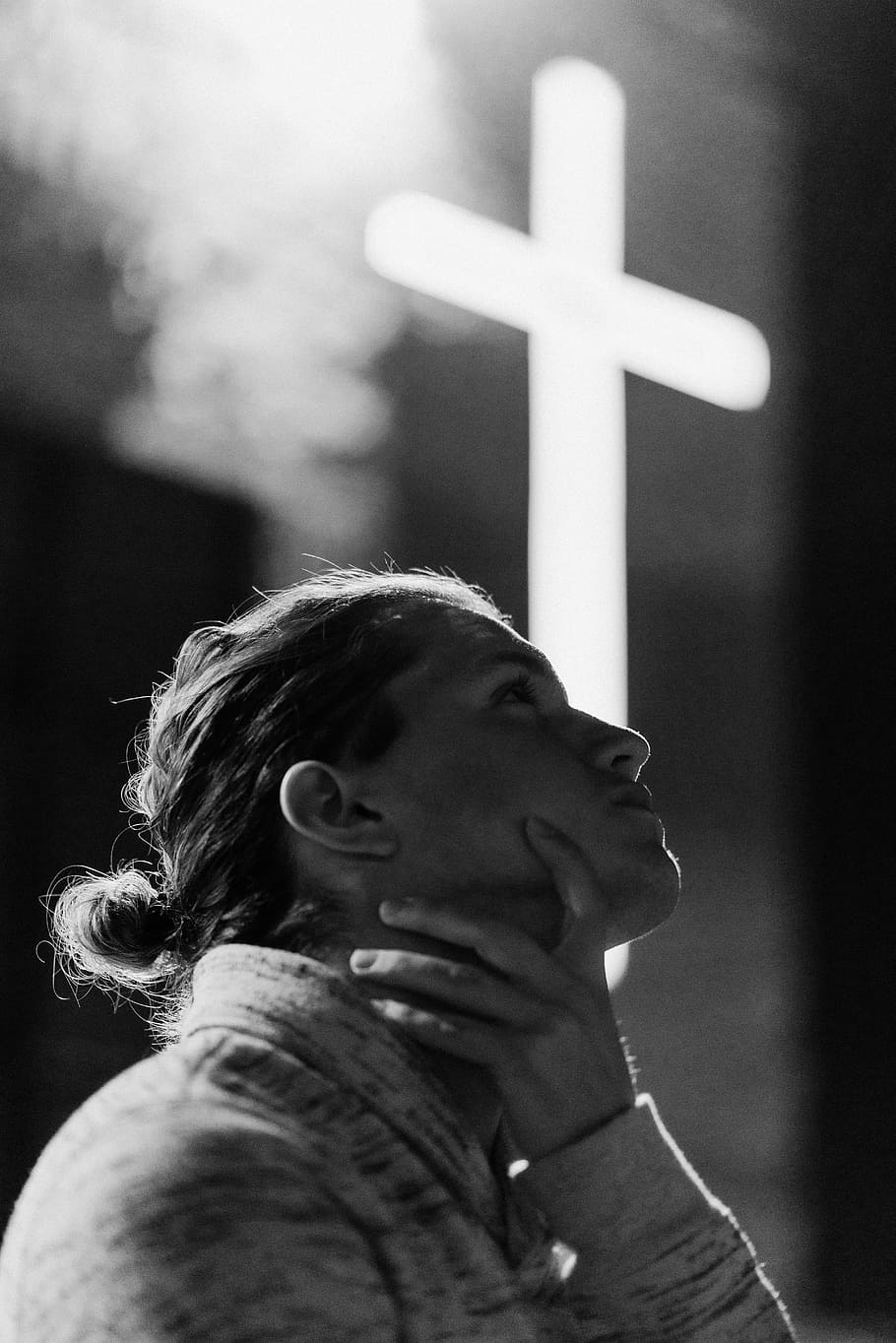 grayscale photography of woman standing near white cross signage, woman holding her neck HD wallpaper