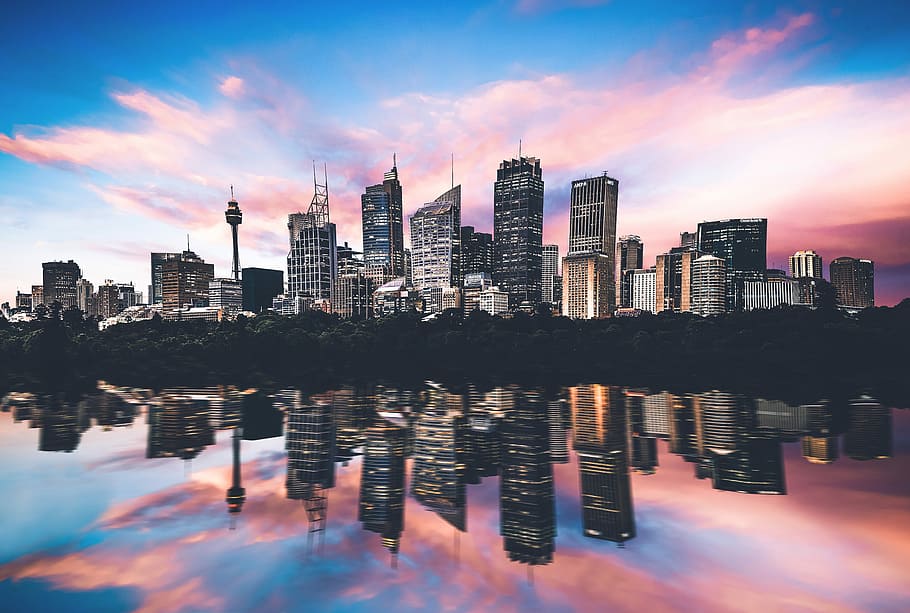 gray buildings under sunset, skyline, reflection, reflection on water HD wallpaper