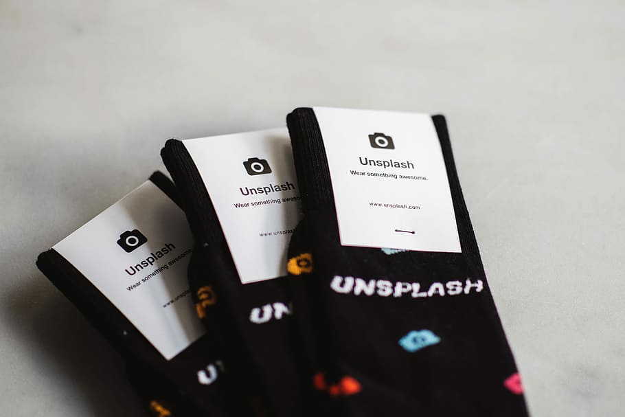 three pairs of black Unflash socks, three Unsplash socks packs HD wallpaper