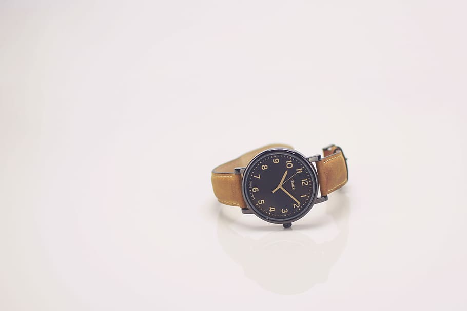 round black analog watch with brown leather band reading at 10:10, round silver-colored analog watch displaying 10:10 HD wallpaper