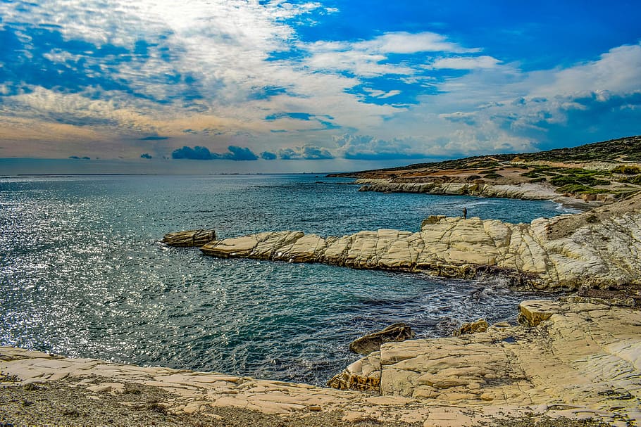 seashore under blue and white sky, sunset, coastline, cliff HD wallpaper