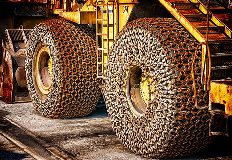 yellow CAT tractor photography, wheel loader, wheels, iron chain HD wallpaper