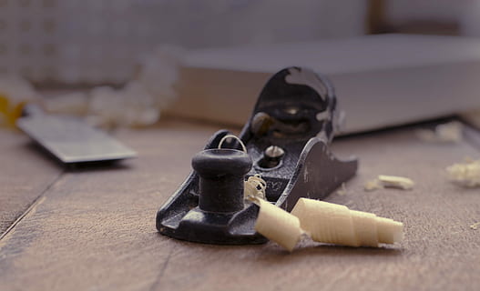 close photography of black jack planer near chisel, brown metal wood plane HD wallpaper