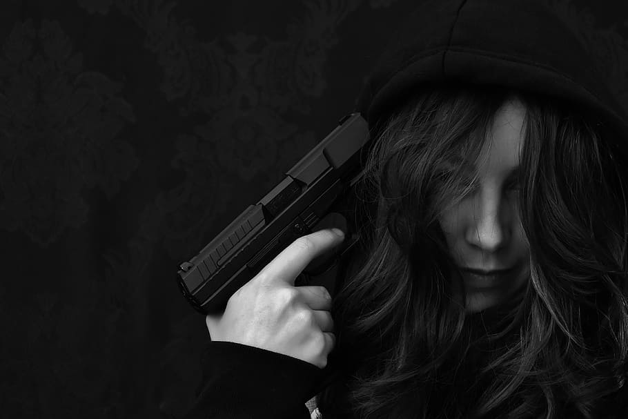 grayscale photo of woman holding gun, hopelessness, despair, not
