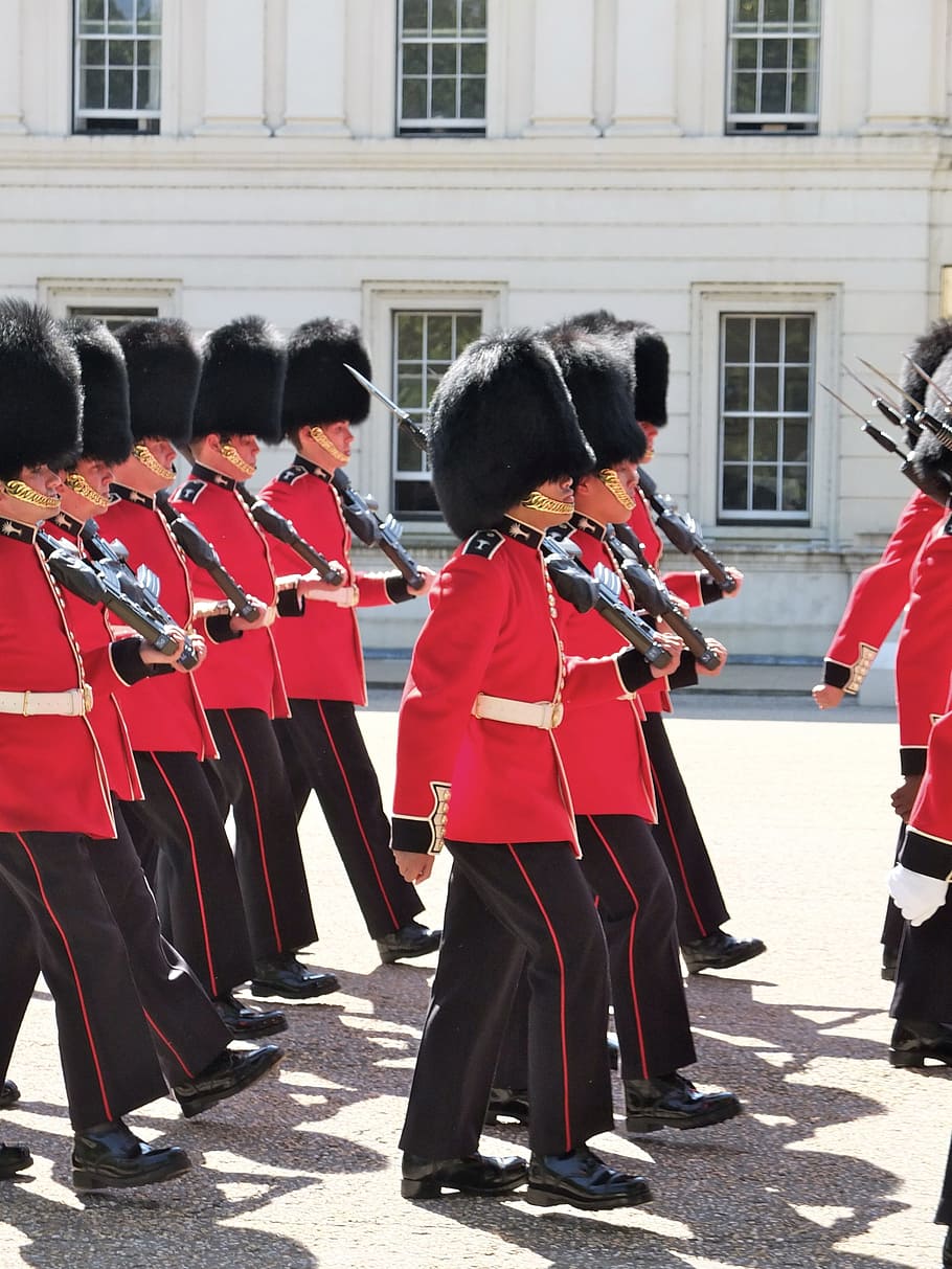 royal guards marching near white building, london, uk, england
