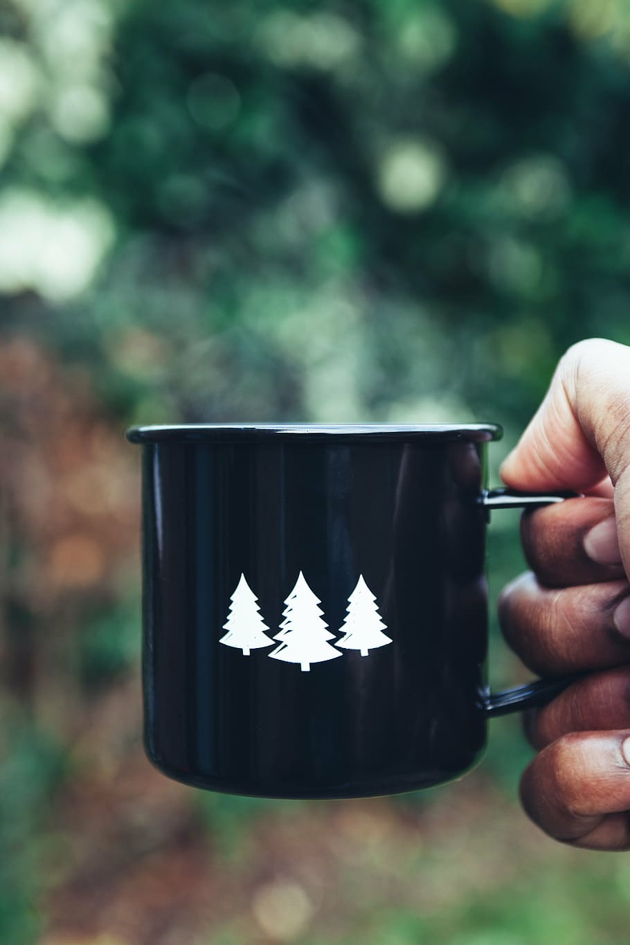 person holding black ceramic mug with pine trees print, hot, coffee, HD wallpaper