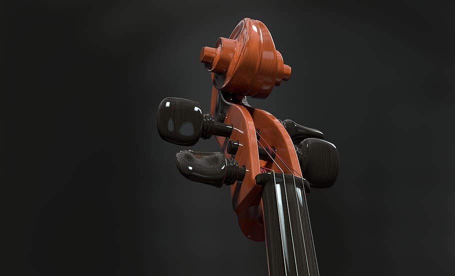 selective focus photograph of violin headstock, cello, strings