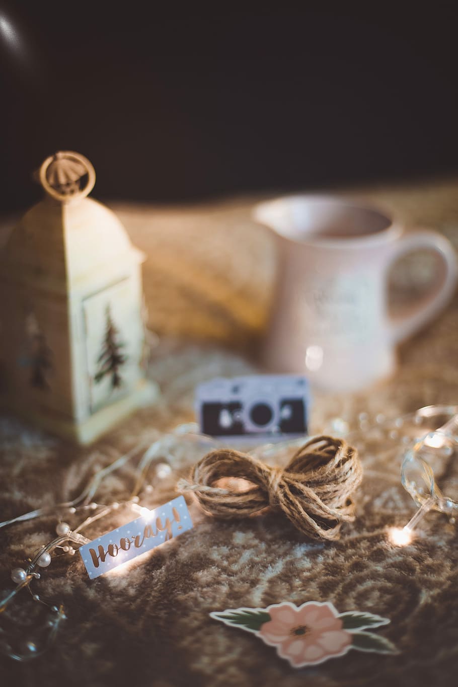 white candle lantern and cream pourer on brown surface, still life HD wallpaper