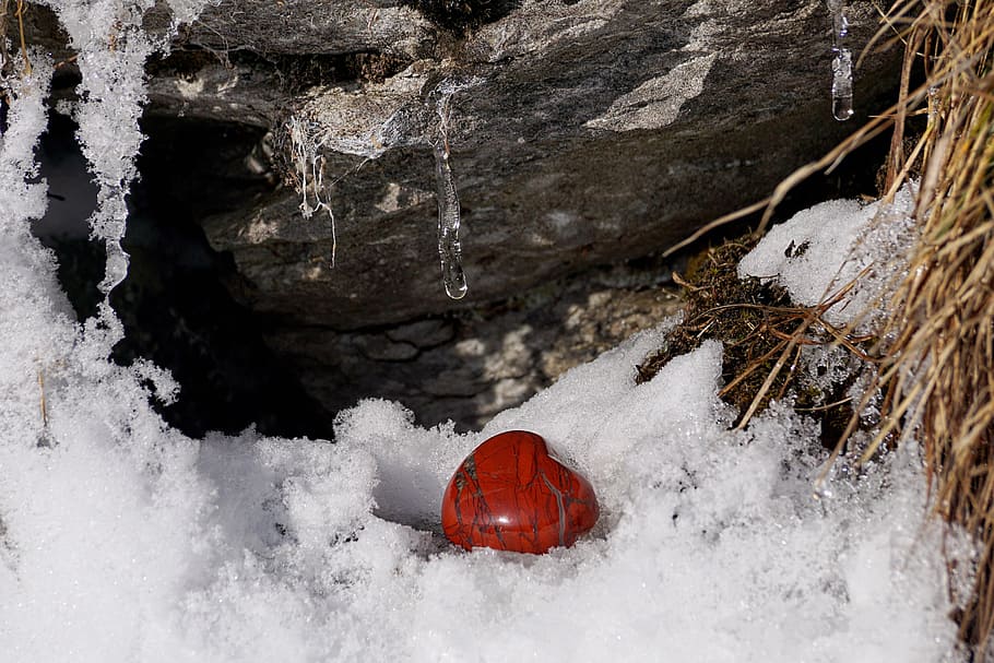 heart-shape red stone surrounded by ice, winter, snow, cold, nature