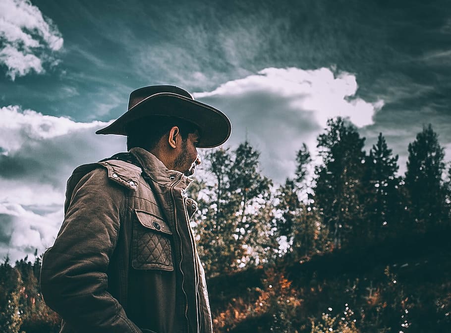 2 Men In Cowboy Jackets And Hats Standing In A Forest Patch Background,  Picture Of Real Cowboys Background Image And Wallpaper for Free Download