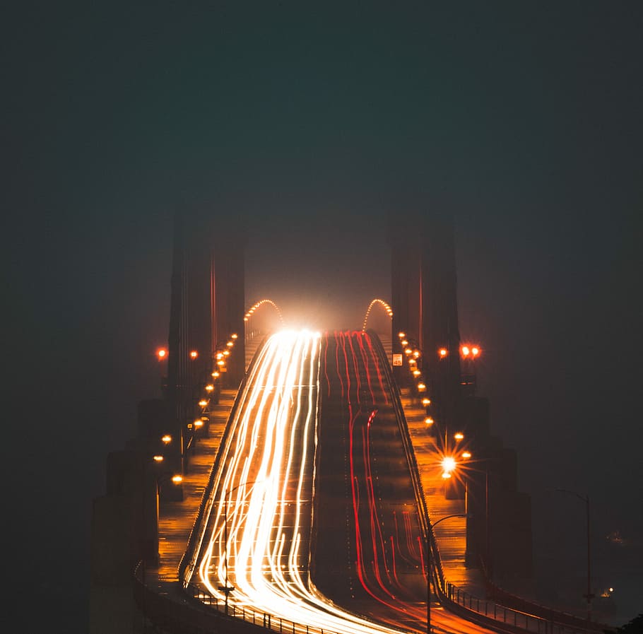 timelapse photography of bridge during night time, vehicle crossing bridge during nighttime HD wallpaper