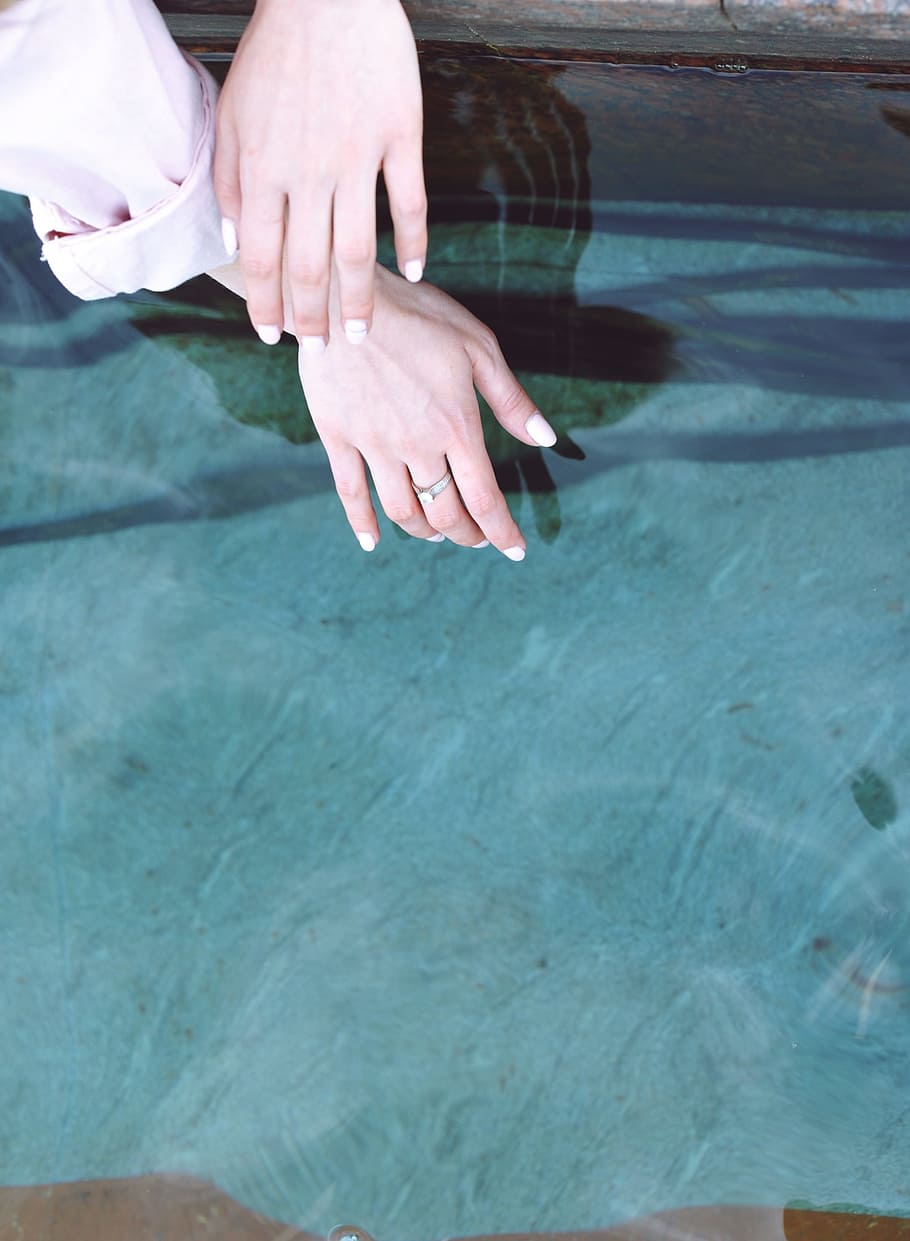 person wearing silver-colored ring, person holding body of water HD wallpaper