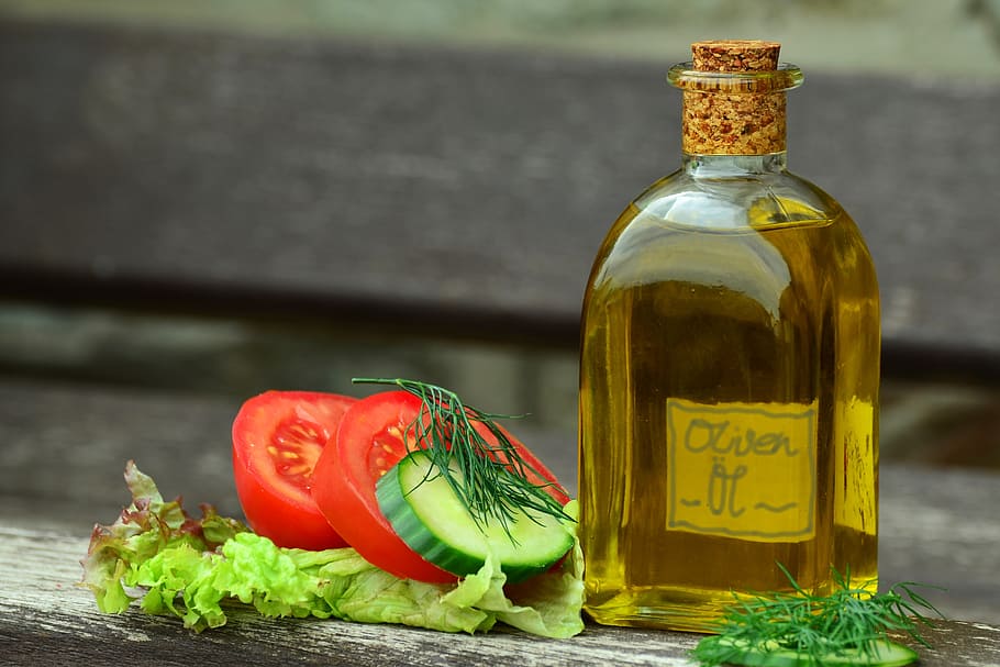 HD wallpaper: olive oil bottle and sliced tomatoes in shallow focus