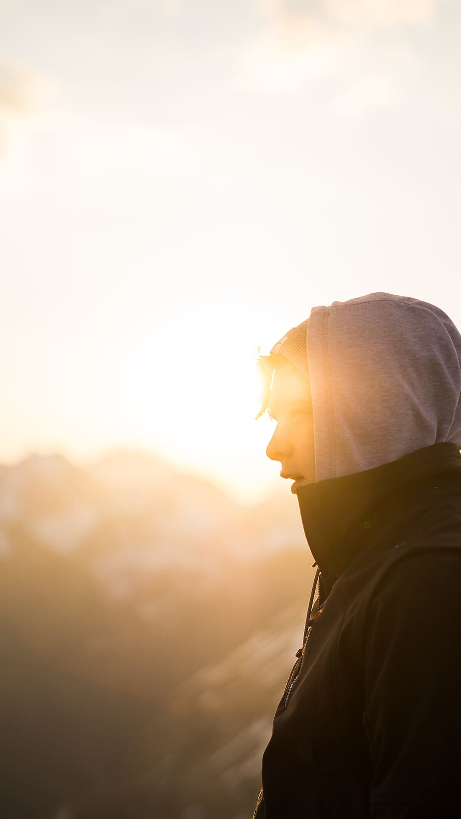 person standing on side view during sunset, selective focus photography of side-view man during golden hour HD wallpaper