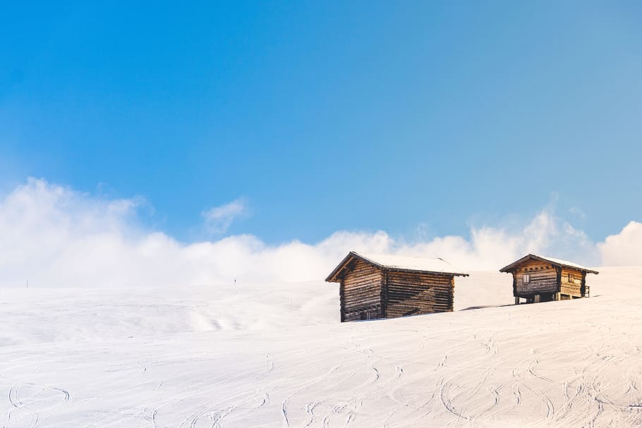 houses covered snowfield, two brown wooden houses during daytime HD wallpaper