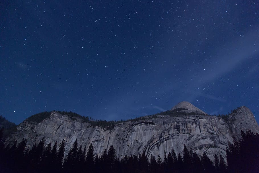 snow-capped mountain under sky, gray cliff under starry sky, silhouette HD wallpaper