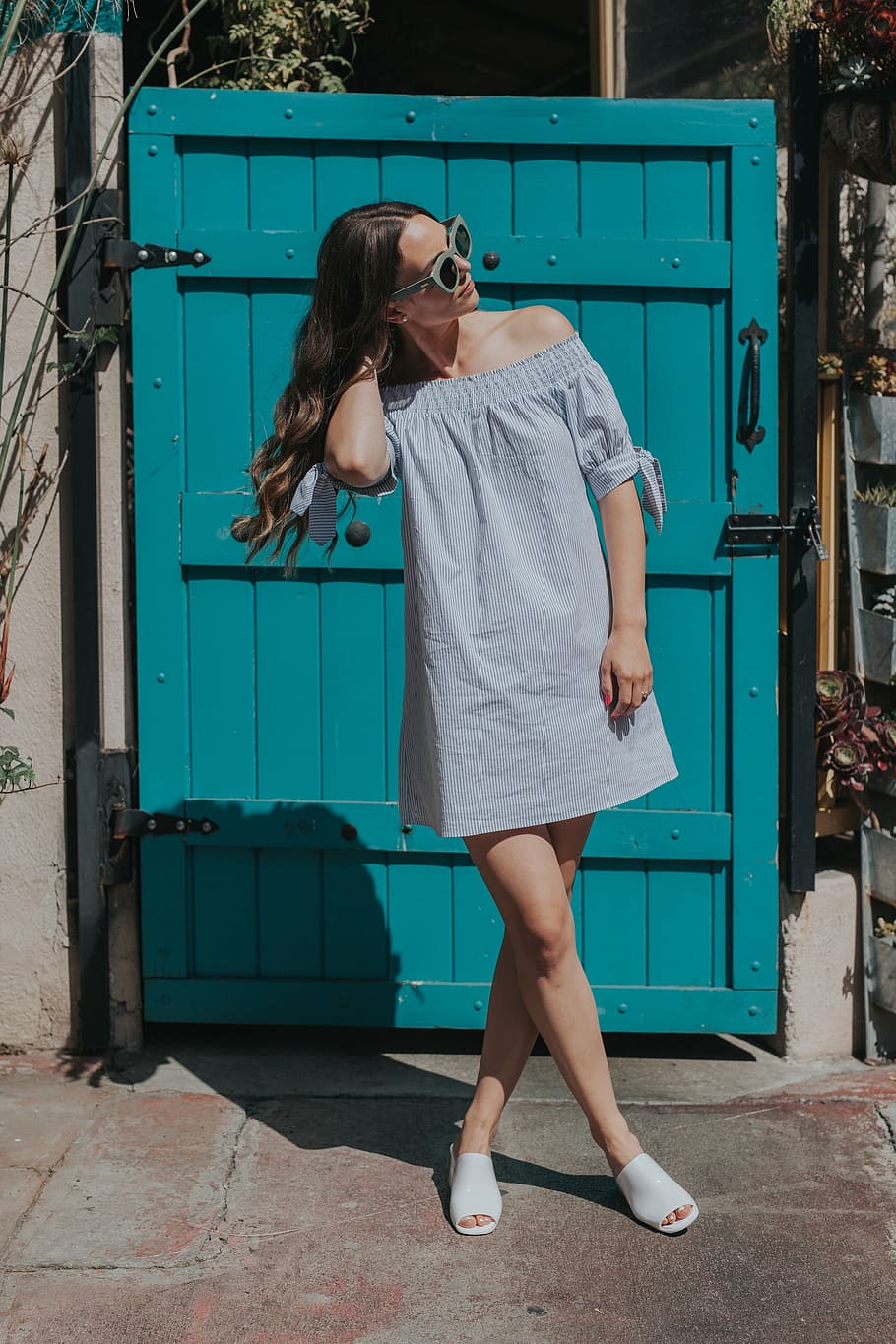 woman standing near blue wooden door, people, girl, alone, fashion