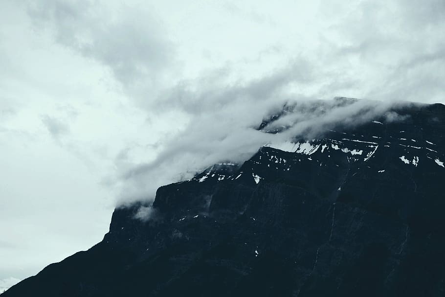 mountain covered by clouds, mountain under cloudy sky during daytime HD wallpaper