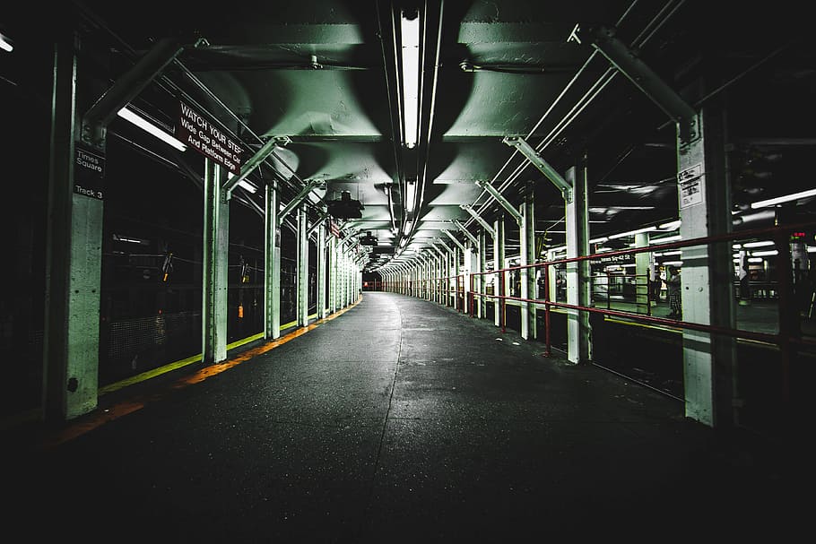 lighted train station pathway, architectural photography of subway road