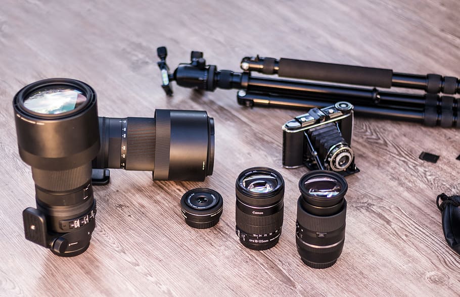 black DSLR camera, analog camera, lenses, tripod, canon, photographic equipment