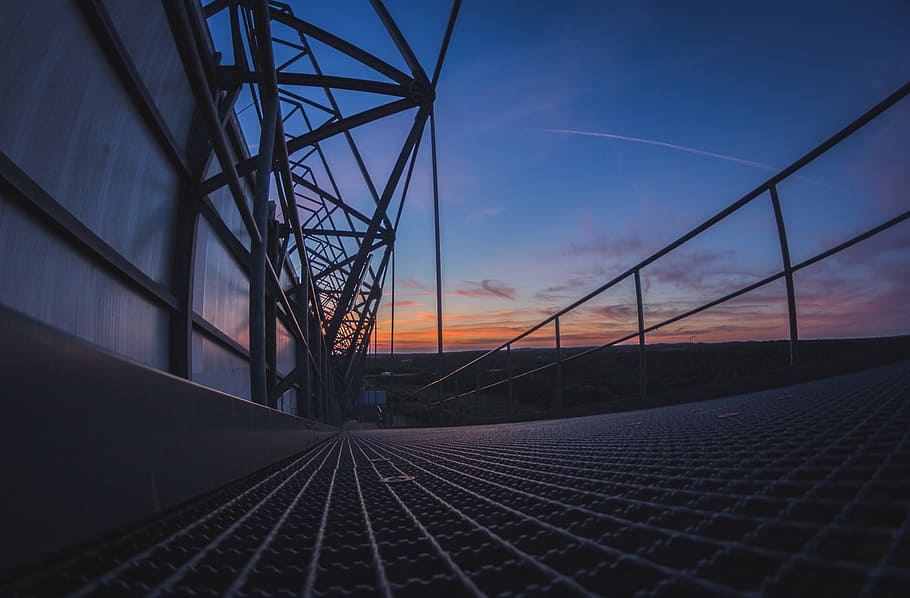 low-angle view of gray metal frames, wide angle photography of metal platform under golden hour HD wallpaper
