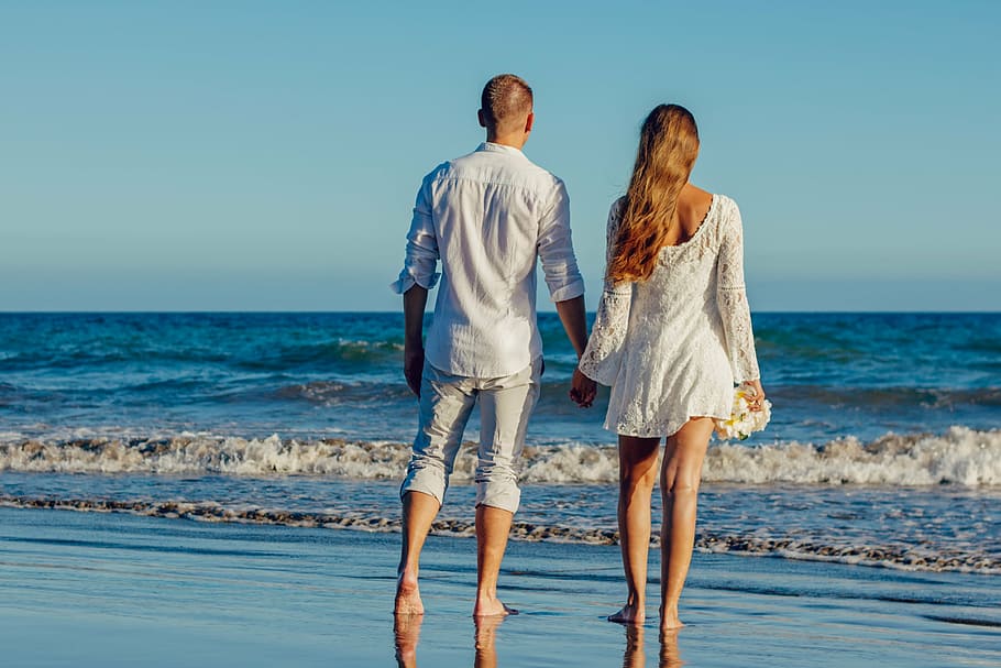 man and woman walking on seashore, wedding, beach wedding, love