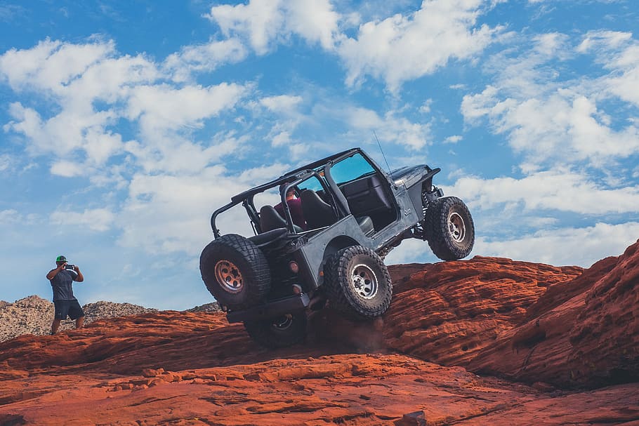 Hd Wallpaper Gray 4x4 Vehicle Climbing The Rock During Daytime Blue Jeep Wrangler On Brown Rock Wallpaper Flare