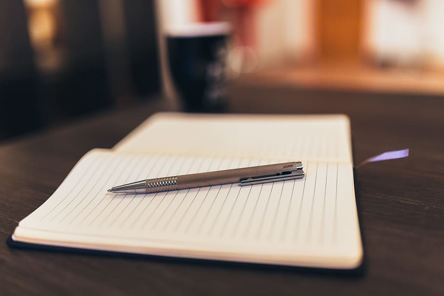 selective focus photography of click pen on white lined paper HD wallpaper